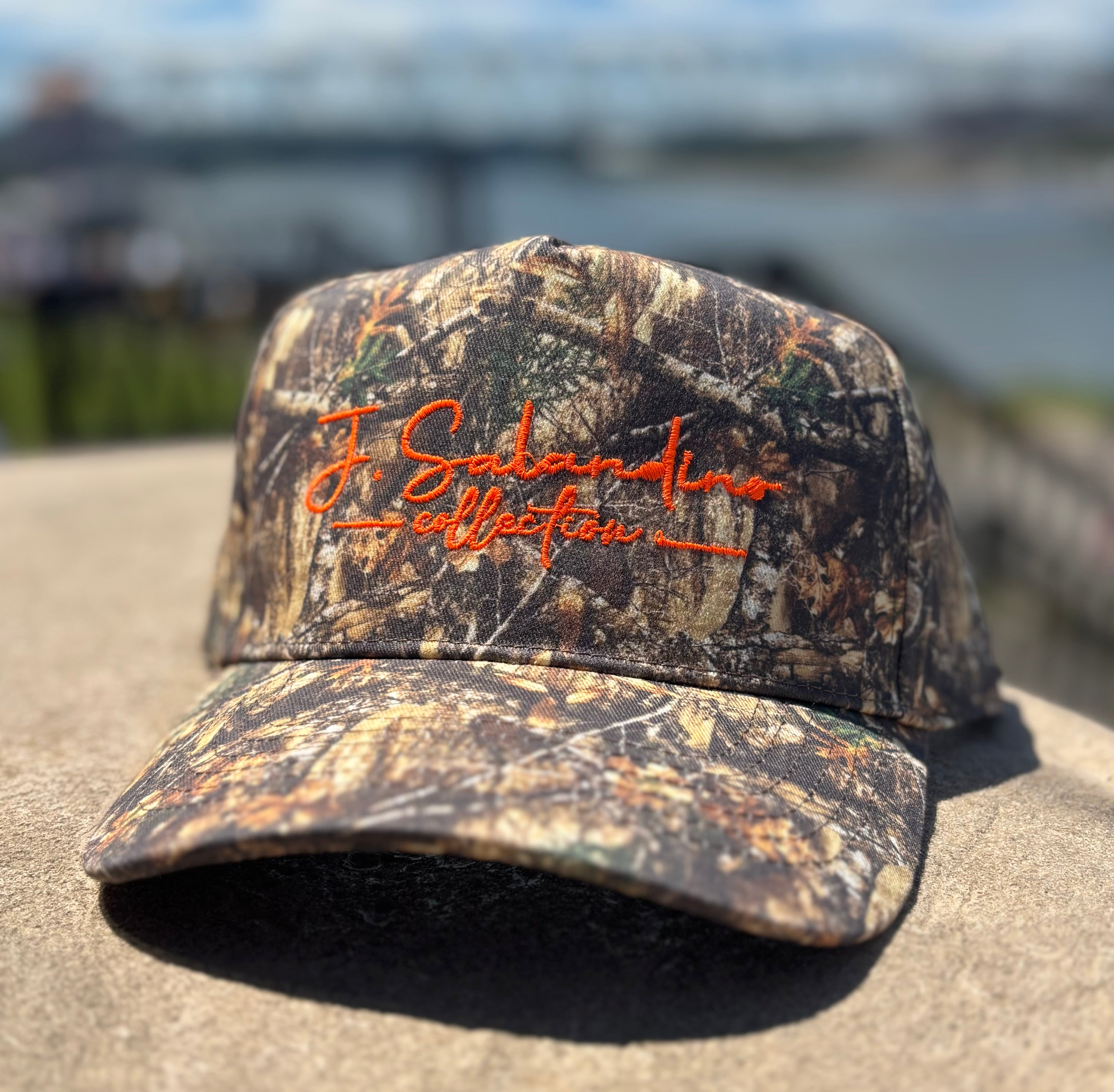 JSal Collection Camo/Orange Trucker